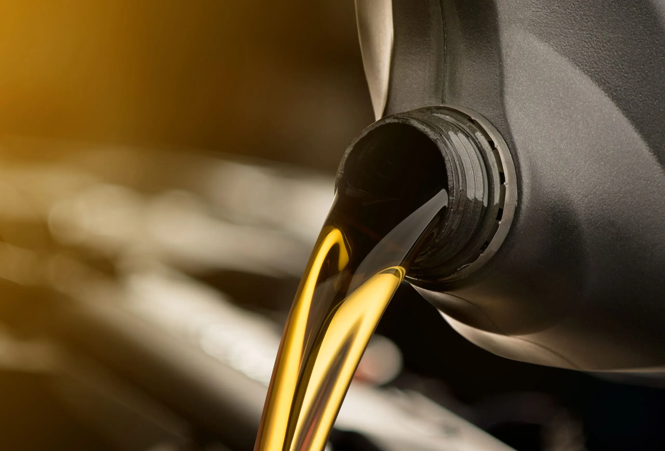 Indonesia Lubricants Market Outlook 2030 pouring-oil-lubricant-motor-car-from-black-bottle-isolated-white-background-1-scaled