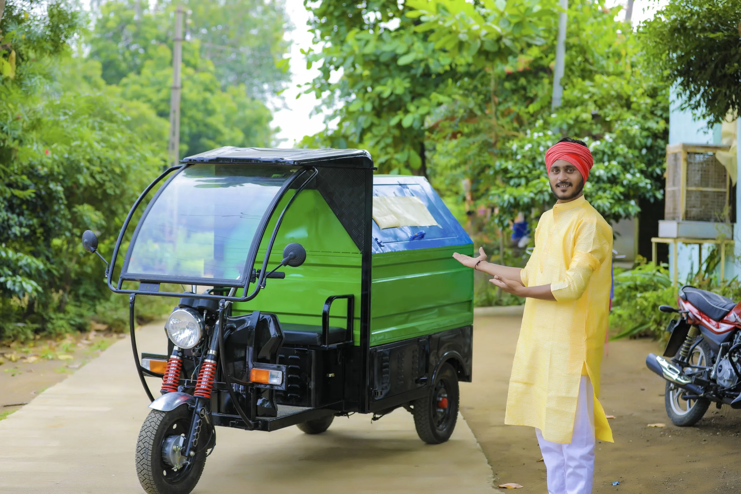 Indonesia Electric 3-Wheeler Market Outlook to 2030 young-indian-man-standing-with-garbage-van-1-scaled