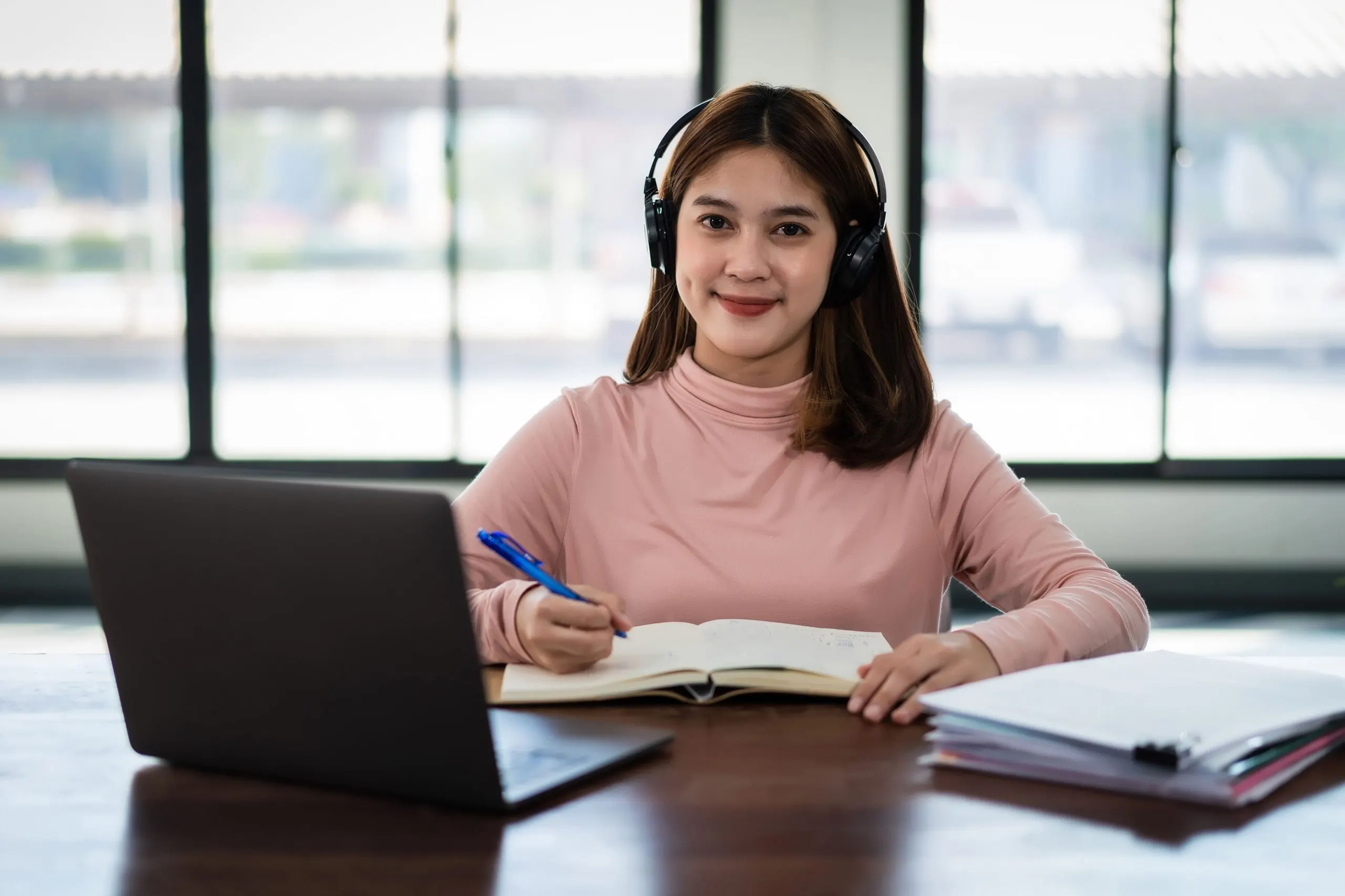 Designed Entry Strategy for UoPeople in India’s Online Education Market smiling-asian-girl-student-wears-wireless-headphones-write-notebook-study-language-online-watch-listen-lecturer-webinar-via-video-call-e-learning-home-distance-education-1-scaled